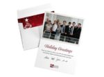 Two greeting cards side by side with one in an envelope next to another featuring a business team photo with a holiday greeting below.