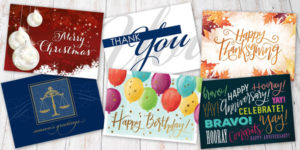 Six different colorful greeting cards lay against a white wood-grain background.