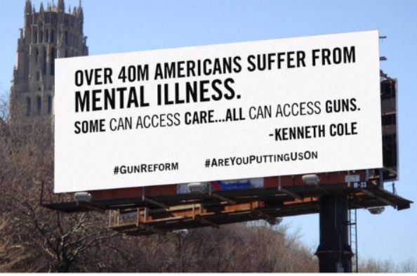 Kenneth Cole billboard in NYC with black text against a white background talking about gun violence and mental illness.