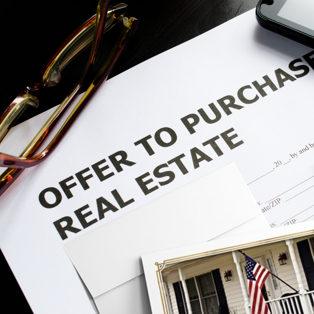 Real estate purchase offer letter next to a greeting card