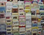 A photo of greeting cards on a shelf in a greeting card store.